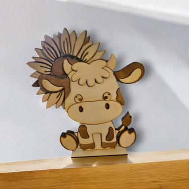 Wooden cow figure with a flower crown, featuring a cute, friendly expression.